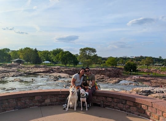 3 dogs and two humans at Falls Park South Dakota