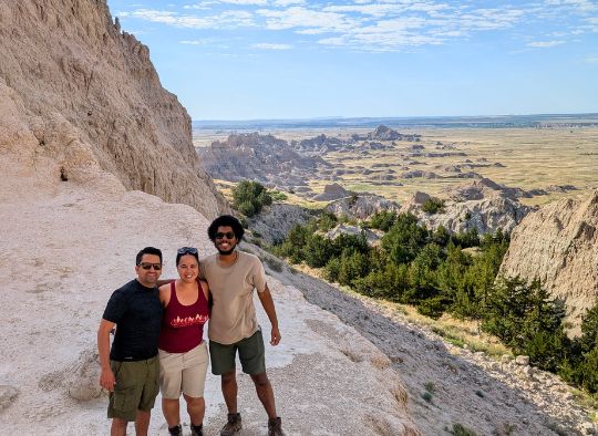 3 people posing at the end of Notch Trail at the overlook