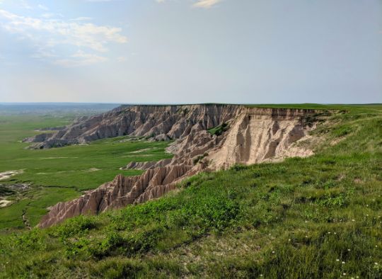 South Unit of Badlands National Park; view of grass and rock formations