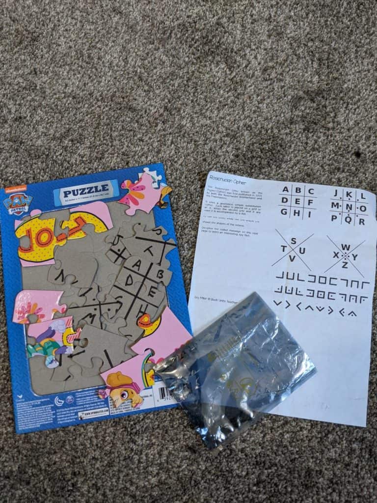 Jigsaw puzzle along with a cipher