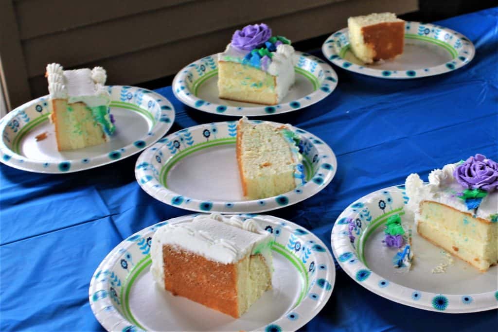 Display of slices of cakes on a blue tablecloth