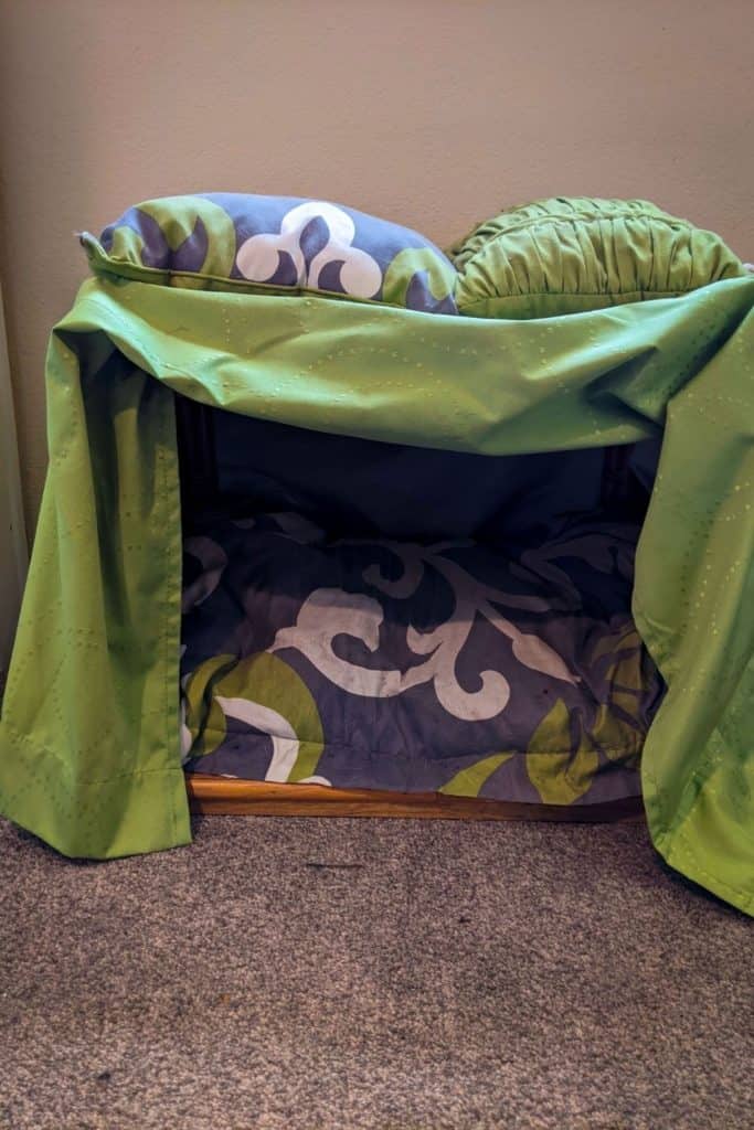 The end table canopy bed now has decorative pillows on top of the matching curtain canopy, in addition to the pillow/bed inside of it.