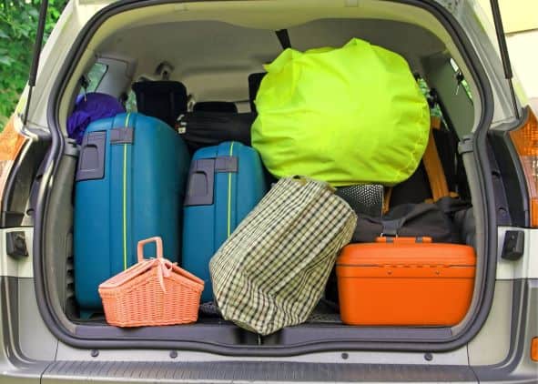 Suitcases and bags in the back of a vehicle