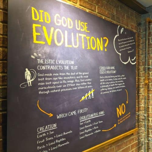 Chalkboard display sign that discusses whether God used Evolution.