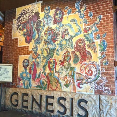 Wall of Art; it has Jesus along with several other characters from the bible depicted on the wall above the words Genesis