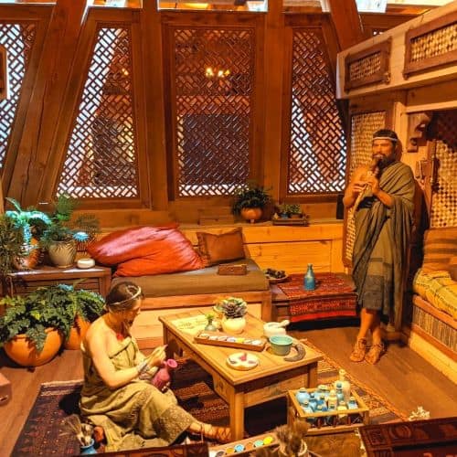 Room set up to show how members of Noah's family lived on the Ark. There is a man and woman in a living room type area.