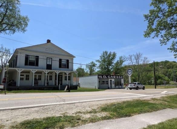 M.D. Garage (a small white garage) to the right of the 2 story Boston Mill Visitor Center building.