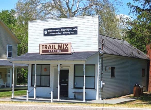 Trail Mix store in Cuyahoga Valley National Park. Building is white with a black door.