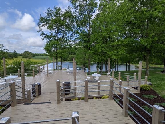 View of back deck and lake behind Casey Jones Distillery