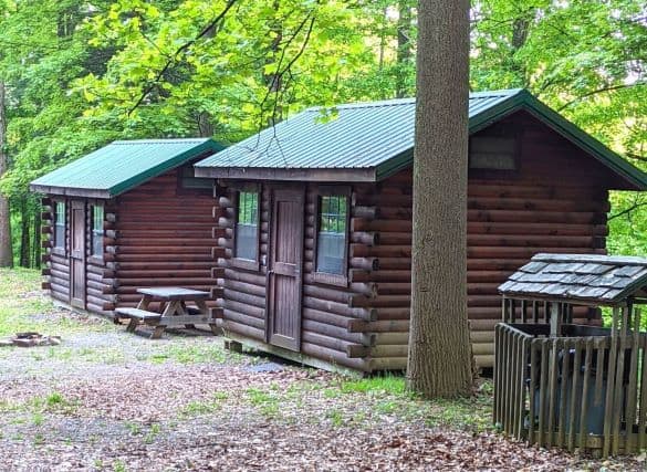 two small log cabins