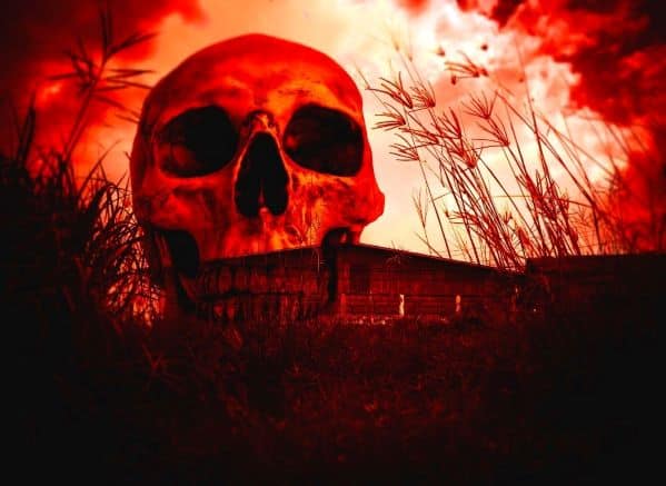 Skull in sky above abandoned house