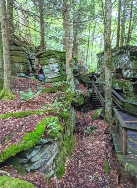 Wooden boardwalk at Beartown State Park winding through rock crevices