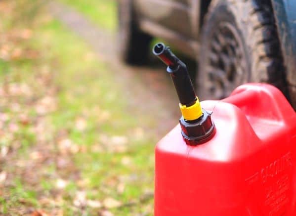gas can on ground near vehicle