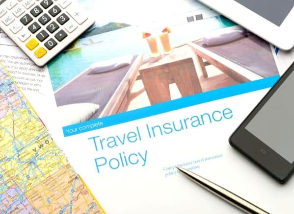 Travel Insurance Policy paperwork displayed on desk