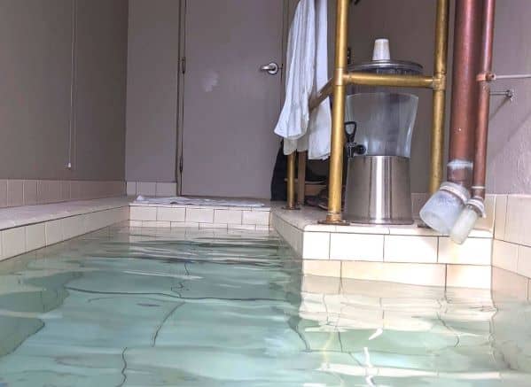 View of room from the tub in Old Roman Spa at Berkeley Springs. You can see the carafe for drinking water