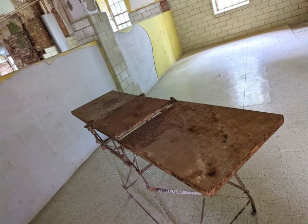 Old stretcher in an empty treatment room