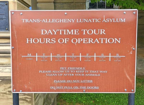 Pet friendly and hours of operation sign for Trans Allegheny Asylum
