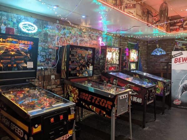 Wall of pinball machines in Toledo's Geekeasy