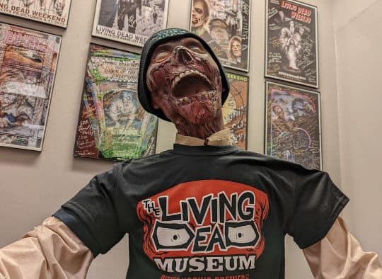 Zombie wearing a Living Dead Museum shirt