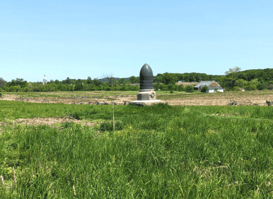 Bullet shaped Memorial in the middle of a field at Gettysburg