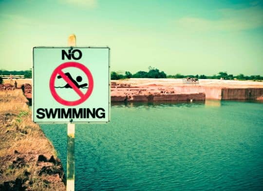 No swimming sign near a reservoir