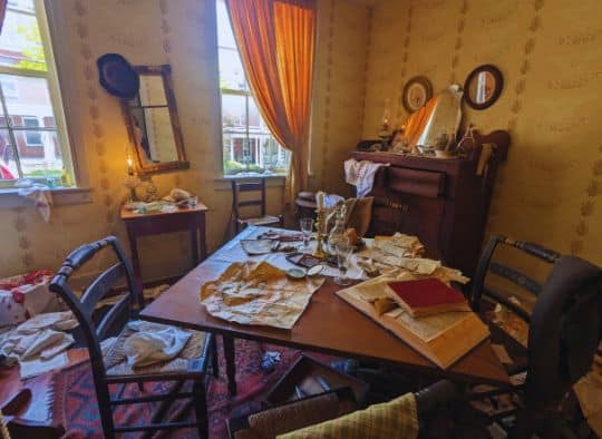 Dining room in disarray from Confederate soldiers trashing it inside Shriver House