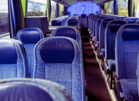 Empty seats inside of a bus