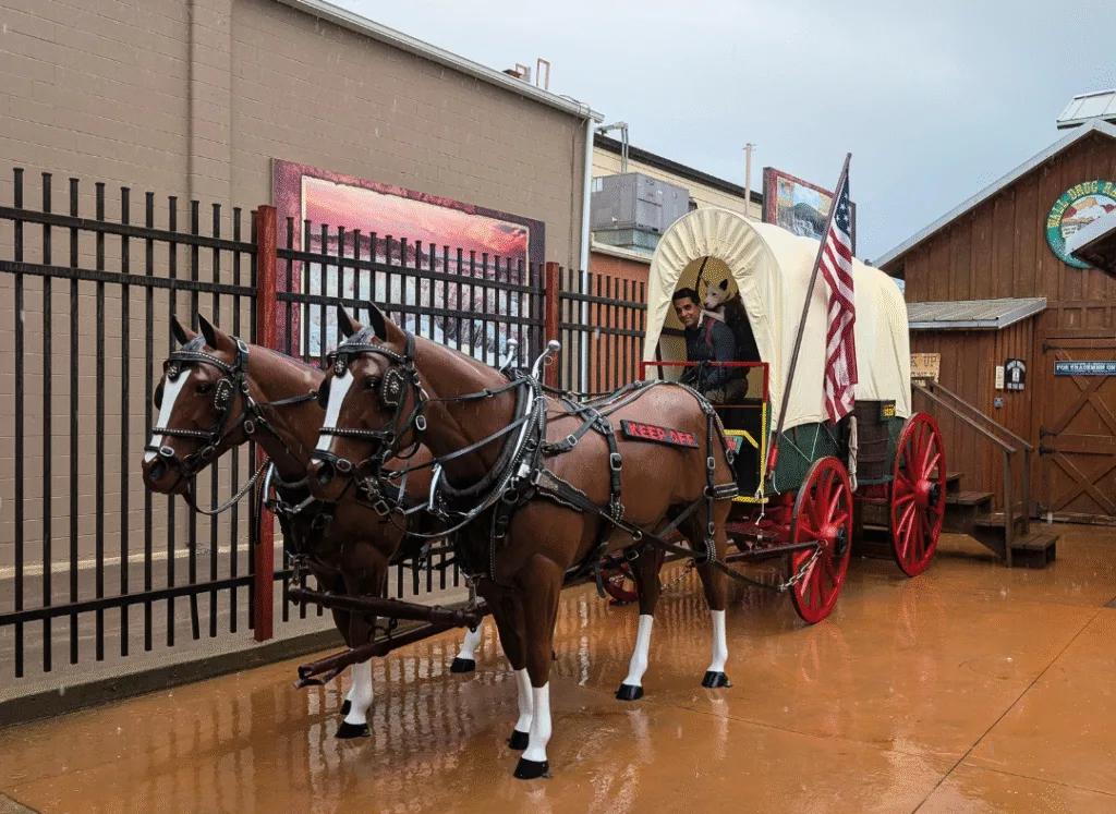Man and dog in a wagon photo op at Wall Drug