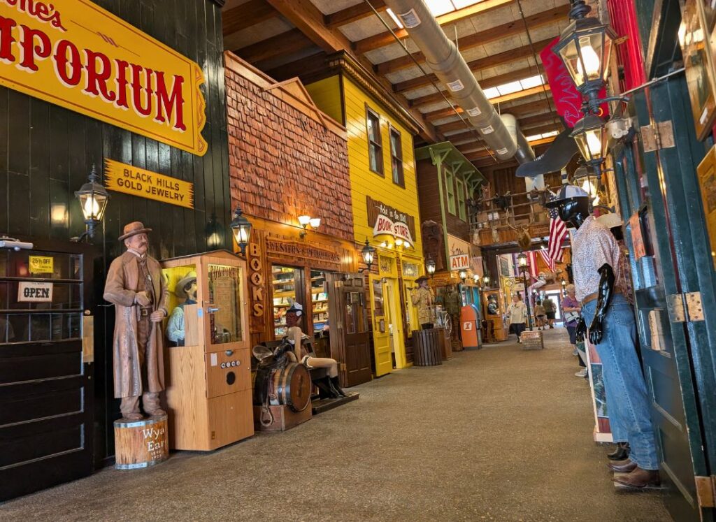 One of the hallways inside Wall Drug full of stores and statues