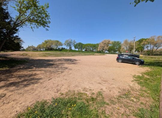 Dirt parking lot for Mitchell Prehistoric Indian Village