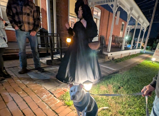 Dog-sitting-in-front-of-Civil-War-Ghost-Tour-guide-carrying-a-lantern