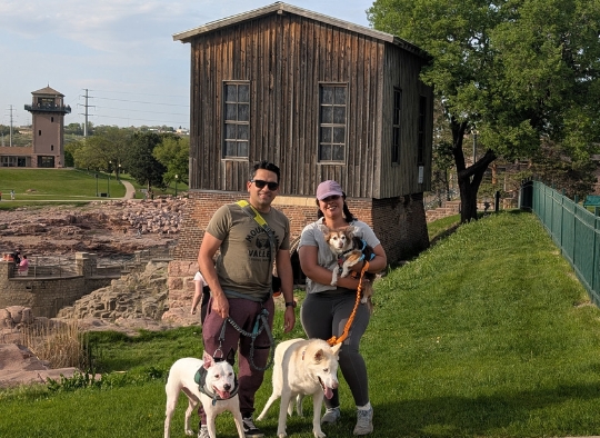Family photo with dogs in front of the Queen Bee Mill