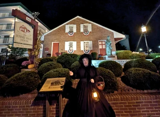 Ghost Tour Guide in front of Jennie Wade House